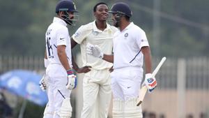 South Africa's Kagiso Rabada, center, reacts as India's Rohit Sharma, right, talks to captain Virat Kohli.(AP) South Africa's Kagiso Rabada, center, reacts as India's Rohit Sharma, right, talks to captain Virat Kohli.(AP)