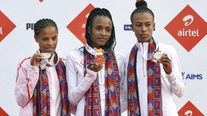 Gold medal winner Ethiopia's Tsehay Gemechu flanked by compatriots silver medallist Yelamzerf Yehualaw (L) and bronze medallist Zeineba Yimer.(PTI) Gold medal winner Ethiopia's Tsehay Gemechu flanked by compatriots silver medallist Yelamzerf Yehualaw (L) and bronze medallist Zeineba Yimer.(PTI)