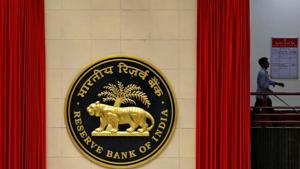A worker walks past the logo of Reserve Bank of India (RBI) inside its office in New Delhi.(Photo: Reuters) A worker walks past the logo of Reserve Bank of India (RBI) inside its office in New Delhi.(Photo: Reuters)