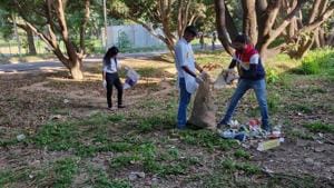 Members of Youth for Swaraj participating in a cleanliness drive at Panjab University in Chandigarh on Wednesday.(HT PHOTO) Members of Youth for Swaraj participating in a cleanliness drive at Panjab University in Chandigarh on Wednesday.(HT PHOTO)