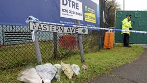 British Police has charged Maurice Robinson for human trafficking, manslaughter and money laundering. In this file picture, floral tributes at the Waterglade Industrial Park in Thurrock, Essex, the day after 39 bodies were found inside a truck on the industrial estate. British media are reporting that the 39 people found dead in the back of a truck in southeastern England were Chinese citizens.(AP)