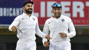 Virat Kohli with teammate Rohit Sharma celebrates the dismissal of South Africa's Quinton de Kock.(PTI) Virat Kohli with teammate Rohit Sharma celebrates the dismissal of South Africa's Quinton de Kock.(PTI)