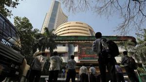 People look at a screen displaying the Sensex results on the facade of the Bombay Stock Exchange (BSE) building in Mumbai.(Photo: Reuters) People look at a screen displaying the Sensex results on the facade of the Bombay Stock Exchange (BSE) building in Mumbai.(Photo: Reuters)