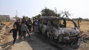 People look at a destroyed van near the village of Barisha, in Idlib province, after an operation by the US military which targeted Abu Bakr al-Baghdadi .(AP photo) People look at a destroyed van near the village of Barisha, in Idlib province, after an operation by the US military which targeted Abu Bakr al-Baghdadi .(AP photo)
