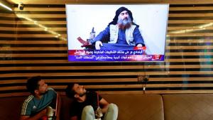 Iraqi youth watch the news of Islamic State leader Abu Bakr al-Baghdadi death, in Najaf, Iraq October 27.(Reuters) Iraqi youth watch the news of Islamic State leader Abu Bakr al-Baghdadi death, in Najaf, Iraq October 27.(Reuters)