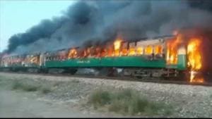 A fire burns a train carriage after a gas canister passengers were using to cook breakfast exploded, near the town of Rahim Yar Khan in the south of Punjab province, Pakistan.(Reuters photo) A fire burns a train carriage after a gas canister passengers were using to cook breakfast exploded, near the town of Rahim Yar Khan in the south of Punjab province, Pakistan.(Reuters photo)