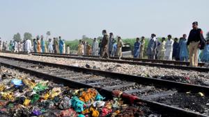 People gather near a track with the charred belongings of passenger victims, after a fire broke out in a passenger train and destroyed three carriages near the town of Rahim Yar Khan, Pakistan, October 31, 2019.(REUTERS) People gather near a track with the charred belongings of passenger victims, after a fire broke out in a passenger train and destroyed three carriages near the town of Rahim Yar Khan, Pakistan, October 31, 2019.(REUTERS)