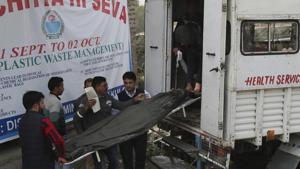 Kashmiri villagers load the body of an Indian laborer who was shot dead by suspected rebels into a waiting ambulance outside a hospital in Kulgam, south of Srinagar.(AP) Kashmiri villagers load the body of an Indian laborer who was shot dead by suspected rebels into a waiting ambulance outside a hospital in Kulgam, south of Srinagar.(AP)
