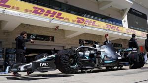 Mercedes driver Lewis Hamilton sits along pit lane.(AP)