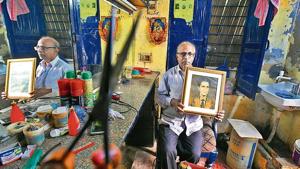 Shankar Bharti (in picture) works at a salon known as ‘University Hairdresser’ near Gwyer Hall in Delhi University area. He is seen here holding a picture of Deep Chand, who started the salon in 1946.(Raj K Raj / HT Photo) Shankar Bharti (in picture) works at a salon known as ‘University Hairdresser’ near Gwyer Hall in Delhi University area. He is seen here holding a picture of Deep Chand, who started the salon in 1946.(Raj K Raj / HT Photo)