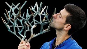 Serbia's Novak Djokovic celebrates with the trophy after winning the Paris Masters.(REUTERS) Serbia's Novak Djokovic celebrates with the trophy after winning the Paris Masters.(REUTERS)