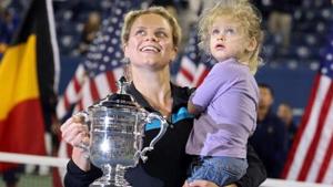 Kim Clijsters of Belgium and daughter Jada pose with the championship trophy.(Getty Images) Kim Clijsters of Belgium and daughter Jada pose with the championship trophy.(Getty Images)