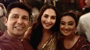 Divya Dutta with Madhuri Dixit and Dr Sriram Nene at a Diwali party. Divya Dutta with Madhuri Dixit and Dr Sriram Nene at a Diwali party.