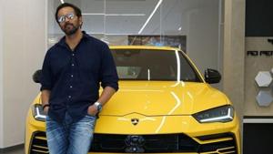 Rohit Shetty poses with his Lamborghini Urus.