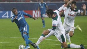 Juventus' Douglas Costa, left, fights for the ball with Lokomotiv's Vedran Corluka during the Champions League Group D soccer match between Lokomotiv Moscow and Juventus at the Lokomotiv Stadium in Moscow, Russia, Wednesday, Nov. 6, 2019.(AP) Juventus' Douglas Costa, left, fights for the ball with Lokomotiv's Vedran Corluka during the Champions League Group D soccer match between Lokomotiv Moscow and Juventus at the Lokomotiv Stadium in Moscow, Russia, Wednesday, Nov. 6, 2019.(AP)
