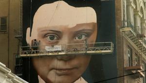 Andres Petreselli paints a mural on the side of a building depicting Swedish teen climate activist Greta Thunberg in San Francisco.(AP) Andres Petreselli paints a mural on the side of a building depicting Swedish teen climate activist Greta Thunberg in San Francisco.(AP)