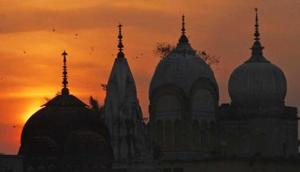 Birds fly at sunset over a Hindu temple on the 20th anniversary of the Babri mosque demolition in Ayodhya. Photo(AP) Birds fly at sunset over a Hindu temple on the 20th anniversary of the Babri mosque demolition in Ayodhya. Photo(AP)
