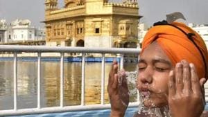 A devotee takes a dip in the holy sarovar (pond) at the Golden Temple, Amritsar.(Gurpreet Singh/HT Photo) A devotee takes a dip in the holy sarovar (pond) at the Golden Temple, Amritsar.(Gurpreet Singh/HT Photo)
