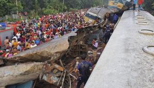 People gather near badly damages coaches after two speeding trains collided, east of the capital, Dhaka, Bangladesh, Tuesday, Nov.12, 2019.(AP) People gather near badly damages coaches after two speeding trains collided, east of the capital, Dhaka, Bangladesh, Tuesday, Nov.12, 2019.(AP)