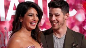 Priyanka Chopra and husband Nick Jonas pose at the premiere for the movie Isn't It Romantic.(REUTERS)