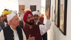 Jaspal interacting with governor of Pakistan Punjab, Chaudhry Mohammad Sarwar during an exhibition of sacred trees of Sikhism curated by him, on Wednesday.(HT Photo) Jaspal interacting with governor of Pakistan Punjab, Chaudhry Mohammad Sarwar during an exhibition of sacred trees of Sikhism curated by him, on Wednesday.(HT Photo)