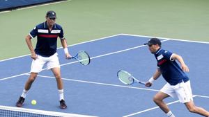 File image: Mike Bryan, left, returns a shot as his brother Bob Bryan, looks on(AP) File image: Mike Bryan, left, returns a shot as his brother Bob Bryan, looks on(AP)