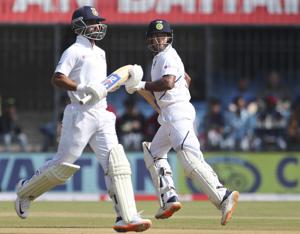 India's Mayank Agarwal, right, and batting partner Ajinkya Rahane run between the wickets to score during the second day of first cricket test match between India and Bangladesh in Indore.(AP) India's Mayank Agarwal, right, and batting partner Ajinkya Rahane run between the wickets to score during the second day of first cricket test match between India and Bangladesh in Indore.(AP)