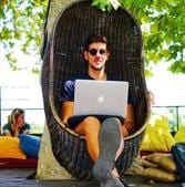 Remote web developer Renato de Leão works at a garden cafe on a trip to Belgrade with Hacker Paradise. ‘They provided a stable work environment through my working holiday,’ he says. Remote web developer Renato de Leão works at a garden cafe on a trip to Belgrade with Hacker Paradise. ‘They provided a stable work environment through my working holiday,’ he says.