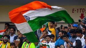 A cricket fan (C) waves the national flag during the third day of the first Test between India and Bangladesh at Holkar Cricket Stadium in Indore.(AFP) A cricket fan (C) waves the national flag during the third day of the first Test between India and Bangladesh at Holkar Cricket Stadium in Indore.(AFP)