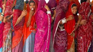 Women wait in a queue to cast their votes at a polling station in Rajasthan.(Reuters Photo (Representative image)) Women wait in a queue to cast their votes at a polling station in Rajasthan.(Reuters Photo (Representative image))