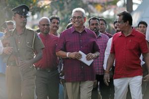 Sri Lanka People's Front party presidential election candidate and former wartime defence chief Gotabaya Rajapaksa leaves after casting his vote during the presidential election in Colombo, Sri Lanka.(REUTERS) Sri Lanka People's Front party presidential election candidate and former wartime defence chief Gotabaya Rajapaksa leaves after casting his vote during the presidential election in Colombo, Sri Lanka.(REUTERS)