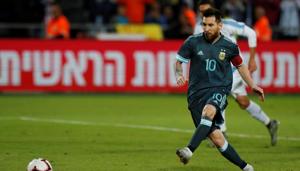 Argentina's Lionel Messi scores their second goal from the penalty spot(REUTERS) Argentina's Lionel Messi scores their second goal from the penalty spot(REUTERS)