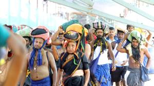 A woman is seen among the crowd of devotees at the Pamba base camp of Sabarimala Temple as the shrine opened for Mandala-Makaravilakku pooja in the evening at Pathanamthitta district of Kerala on Saturday.(Photo: Vivek R Nair/ Hindustan Times) A woman is seen among the crowd of devotees at the Pamba base camp of Sabarimala Temple as the shrine opened for Mandala-Makaravilakku pooja in the evening at Pathanamthitta district of Kerala on Saturday.(Photo: Vivek R Nair/ Hindustan Times)