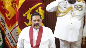 Sri Lanka's new Prime Minister Mahinda Rajapaksa stands for the national anthem at the presidential secretariat in Colombo, Sri Lanka on Thursday.(AP) Sri Lanka's new Prime Minister Mahinda Rajapaksa stands for the national anthem at the presidential secretariat in Colombo, Sri Lanka on Thursday.(AP)