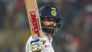 Kolkata: Indian Skipper Virat Kohli raises his bat after scoring half-century on the first day.(PTI) Kolkata: Indian Skipper Virat Kohli raises his bat after scoring half-century on the first day.(PTI)