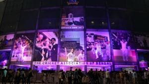 People move in front of Eden Gardens illuminated in pink on the eve of the first day-night test cricket match between India and Bangladesh(REUTERS) People move in front of Eden Gardens illuminated in pink on the eve of the first day-night test cricket match between India and Bangladesh(REUTERS)