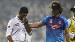 Bangladesh's Mahmudullah, left, leaves the ground with the team's physiotherapist. (AP Photo/Bikas Das)(AP) Bangladesh's Mahmudullah, left, leaves the ground with the team's physiotherapist. (AP Photo/Bikas Das)(AP)