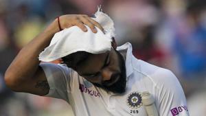 India's Virat Kohli wipes his head with a towel during a break.(AP) India's Virat Kohli wipes his head with a towel during a break.(AP)