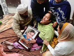 Relatives consoling Prabhleen Kaur’s mother Manjit Kaur after the family was informed about her murder in Canada on Sunday.(HT Photo) Relatives consoling Prabhleen Kaur’s mother Manjit Kaur after the family was informed about her murder in Canada on Sunday.(HT Photo)
