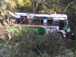 The bus after it fell into the gorge in Kangra district on Monday afternoon.(HT Photo) The bus after it fell into the gorge in Kangra district on Monday afternoon.(HT Photo)