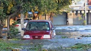A car is seen submerged in the flooded water after Hulimavu lake breached in Bengaluru on Sunday.(PTI) A car is seen submerged in the flooded water after Hulimavu lake breached in Bengaluru on Sunday.(PTI)