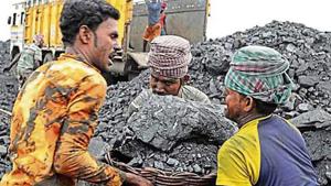 Labourers lift a large basket filled with coal in the village of Godhar in Jharia, Jharkhand(AP File) Labourers lift a large basket filled with coal in the village of Godhar in Jharia, Jharkhand(AP File)