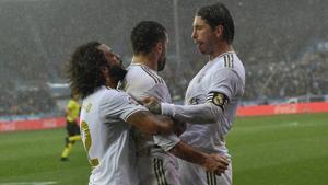Real Madrid's Dani Carvajal, center, celebrates with teammates Sergio Ramos, right, and Marcelo.(AP) Real Madrid's Dani Carvajal, center, celebrates with teammates Sergio Ramos, right, and Marcelo.(AP)