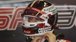 Charles Leclerc of Monaco puts on his helmet during the first free practice at the Yas Marina racetrack in Abu Dhabi.(AP) Charles Leclerc of Monaco puts on his helmet during the first free practice at the Yas Marina racetrack in Abu Dhabi.(AP)