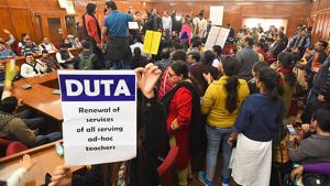 Members of Delhi University Teachers' Association (DUTA) hold placards and shout slogans during a protest demanding the withdrawal of University's August 28 letter which involves appointment of ad-hoc and guest lecturers, inside the VC executive council hall, at Delhi University, in New Delhi, India, on Wednesday, December 4, 2019.(Raj K Raj/HT PHOTO) Members of Delhi University Teachers' Association (DUTA) hold placards and shout slogans during a protest demanding the withdrawal of University's August 28 letter which involves appointment of ad-hoc and guest lecturers, inside the VC executive council hall, at Delhi University, in New Delhi, India, on Wednesday, December 4, 2019.(Raj K Raj/HT PHOTO)