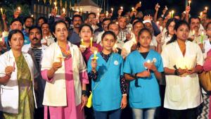 Veterinary doctors participating in a candlelight protest after the gangrape and murder of a vet on the outskirts of Hyderabad.(PTI PHOTO.) Veterinary doctors participating in a candlelight protest after the gangrape and murder of a vet on the outskirts of Hyderabad.(PTI PHOTO.)