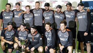 New Zealand players pose with the trophy after the second cricket test between England and New Zealand at Seddon Park.(AP) New Zealand players pose with the trophy after the second cricket test between England and New Zealand at Seddon Park.(AP)