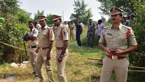 Policemen stand guard the area where four accused in the rape and murder case of a veterinarian were shot dead in an encounter early Friday at Shadnagar of Ranga Reddy district in Hyderabad.(PTI) Policemen stand guard the area where four accused in the rape and murder case of a veterinarian were shot dead in an encounter early Friday at Shadnagar of Ranga Reddy district in Hyderabad.(PTI)