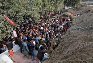 People gather outside the house of the 24-year-old rape victim, who died in a New Delhi hospital on Friday after she was set on fire by a gang of men, which included her alleged rapists, in Uttar Pradesh’s Unnao.(REUTERS Photo) People gather outside the house of the 24-year-old rape victim, who died in a New Delhi hospital on Friday after she was set on fire by a gang of men, which included her alleged rapists, in Uttar Pradesh’s Unnao.(REUTERS Photo)