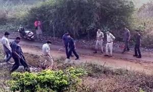Police at the site of the alleged encounter of the four accused in the rape and murder of a veterinary on the outskirts of Hyderabad on Friday morning.(PTI PHOTO.) Police at the site of the alleged encounter of the four accused in the rape and murder of a veterinary on the outskirts of Hyderabad on Friday morning.(PTI PHOTO.)